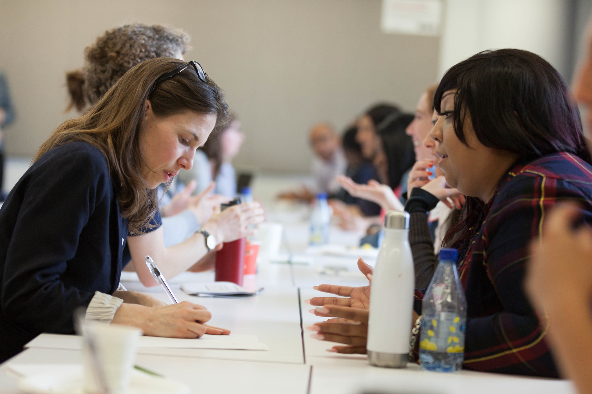 Julie harris speaking with Jackie Torres at a Grantee event