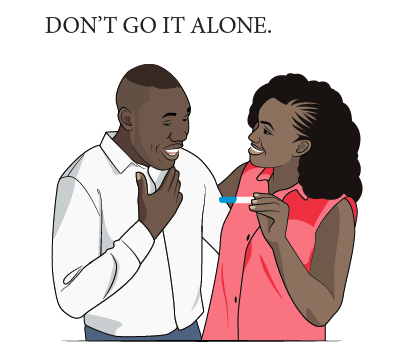 black couple happily looking at positive pregnancy test